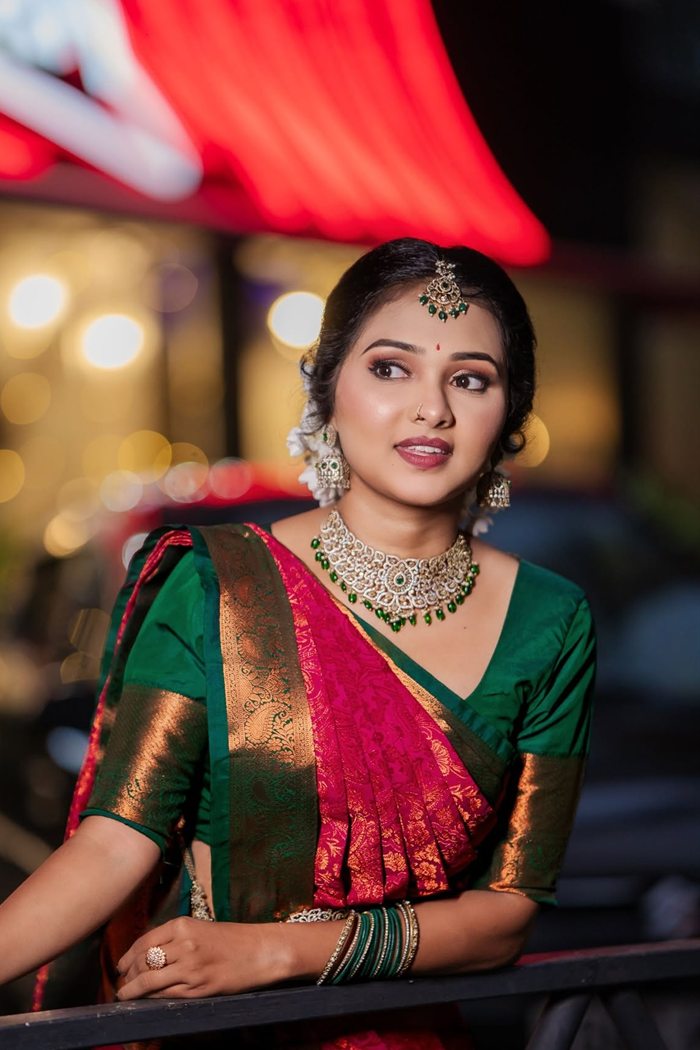 Bridal portrait in pink and green saree with diamond necklace, evening bokeh, Jaffna