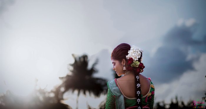 Bride's floral hairstyle silhouette against a dramatic sky, Ashvi Beauty Care Jaffna